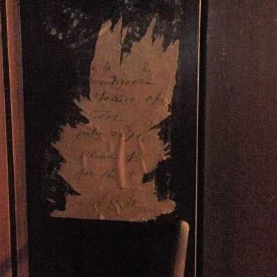 Detail of label inside organ cabinet door