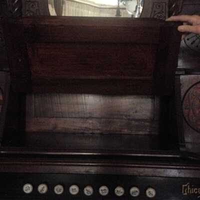 Organ with music sheet storage door open
