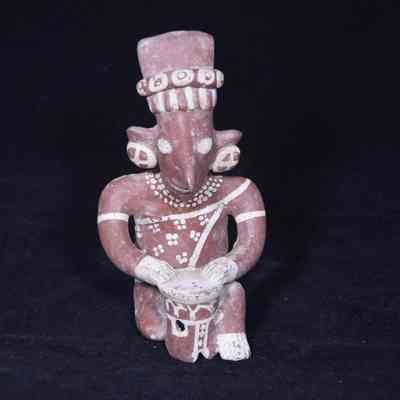 Seated drummer figure