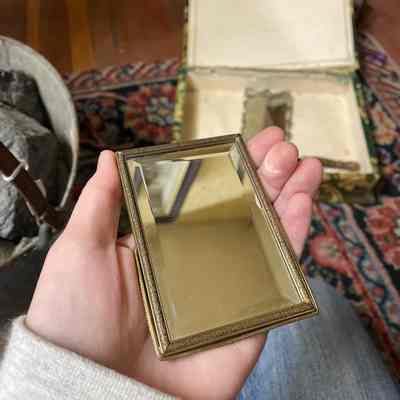 Small yellow metal mirror