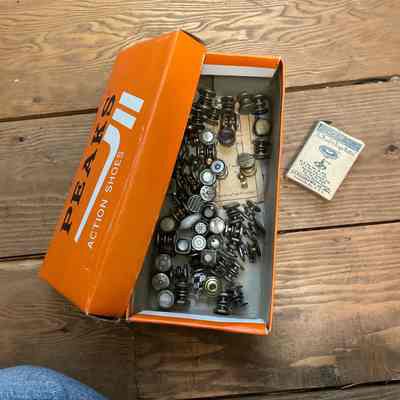 Shoe box full of buttons