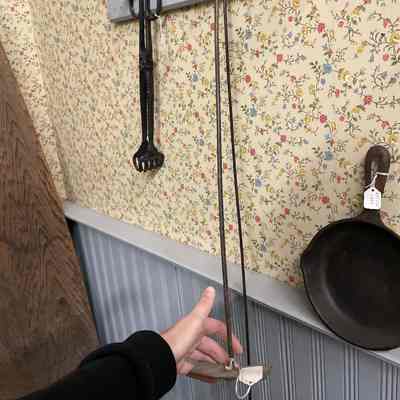 Small metal fireplace rake