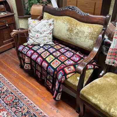 Green velvet dark wood couch