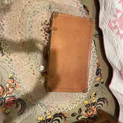 Reddish brown suitcase