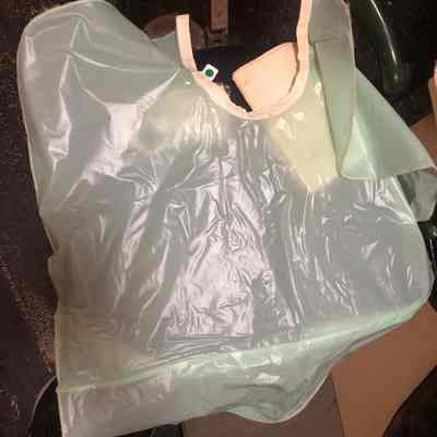 Green plastic dental cape/bib