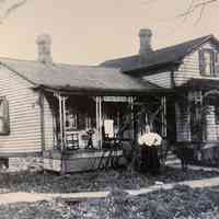 Eliza Jane Eldridge in front of her home in Angelica, New York, where she ran her dressmaking business. The sign above the door reads, "Dress Making" (Copy).