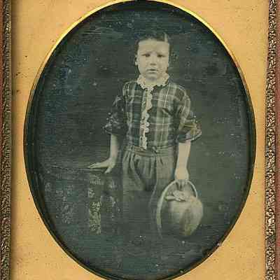 Boy in Plaid Top with Beaver Hat