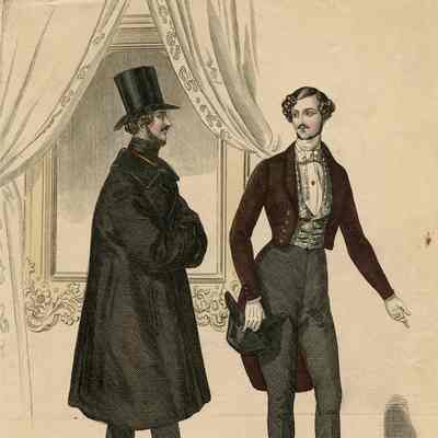 2 Men in Lobby, One in Large Coat