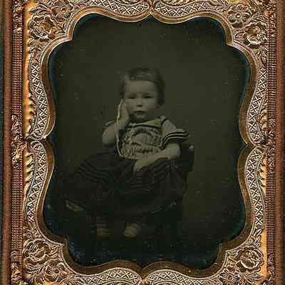 Little Boy with Watch to Ear