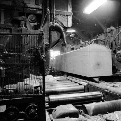 Louisiana-Pacific Saw Mill. Large Sugar Pine going passing through the band saw.