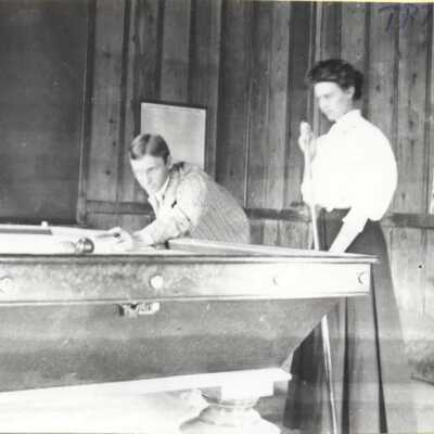 Man and Woman Playing Billiards - Turnback Inn