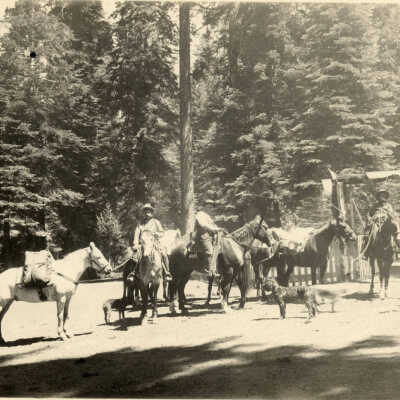 Men on horseback with pack horses