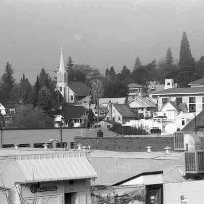 Sonora scene with St. Patrick's Catholic Church and Tuo. Co. Courthouse, from S. Stewart St.