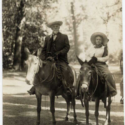 Man & Woman on horse and mule