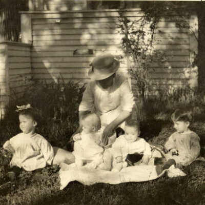 Unidentified woman and four little children