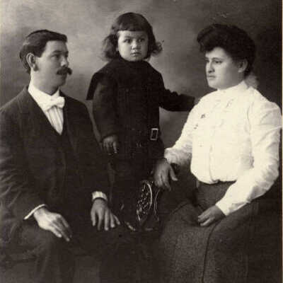 Unidentified man, woman, and child