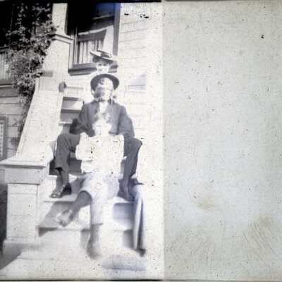 Three people sitting on the steps