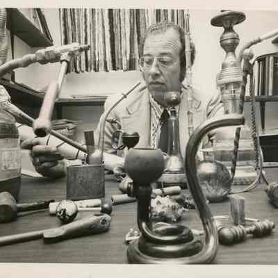 Detective Lt. Frank Hanson Looks Over Collection