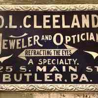 "D.L. Cleeland Jeweler and Optician" Tin & Smalts Sign