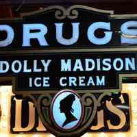Drugs Dolly Madison Tin & Opal Glass Sign