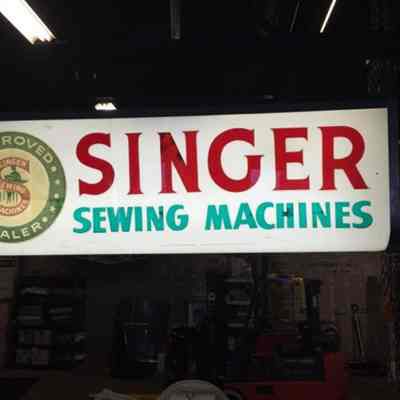 Singer Sewing Machines Sign