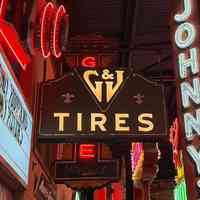          G&J Tires Double-Faced Metal & Opal Glass Sign picture number 1
   