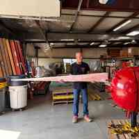          Alan Whitaker demonstrating what the sphere would look like with a spike attached.
   