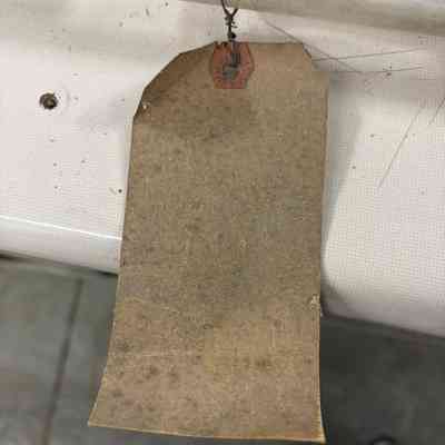 Tag attached to sign