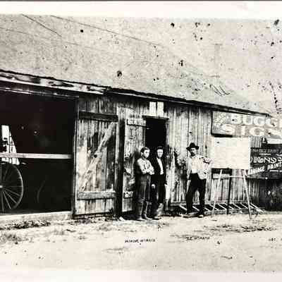 Sign Shop Exterior with Workers - Photograph