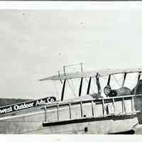 Southwest Outdoor Advertising Company Airplane with Figure - Photograph