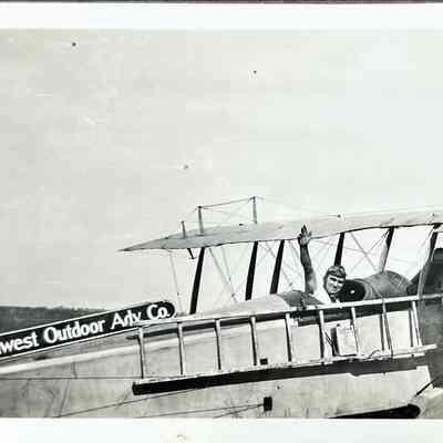 Southwest Outdoor Advertising Company Airplane with Figure - Photograph