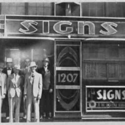 Raiford Sign Co. Exterior with Figures - Photograph