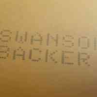          On the back of the A-Frame a company logo is listed for Swanson Backer
   