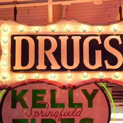 "DRUGS" Federal Lightbulb Sign