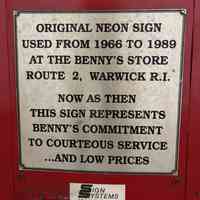          Plaque on the side of Benny's Home & Auto Stores Sign
   