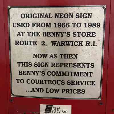 Plaque on the side of Benny's Home & Auto Stores Sign