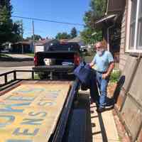          Tod Swormstedt loading up the two tin signs.
   