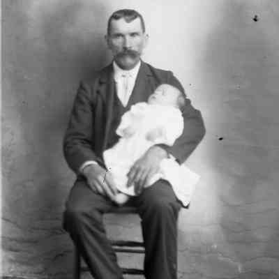 man holding baby