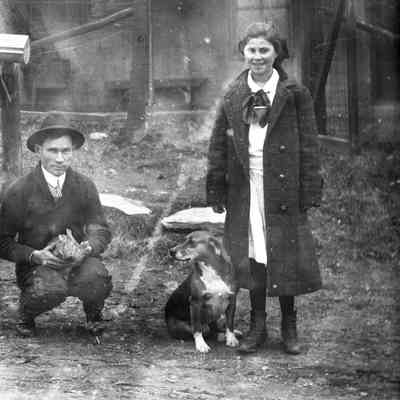 man, woman, dog