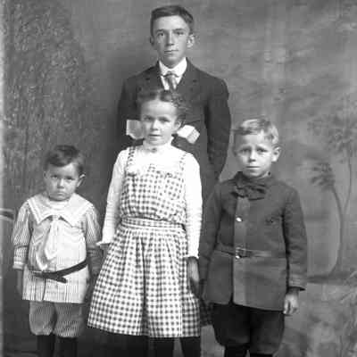 young man and 3 children