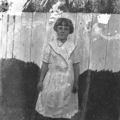 Girl & board fence