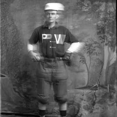 man in baseball uniform/ PV on shirt - blurry