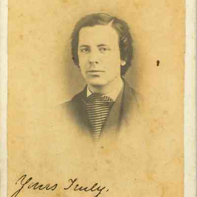 The image is a sepia-toned carte-de-visite featuring Harry J. Shellman, the second child of the Shellman family and older brother of Mary Shellman. He is wearing a formal jacket and striped cravat, with a signature at the bottom reading "Yours Truly, H.J Shellman.