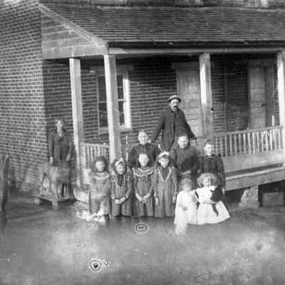 11 people in front of a house