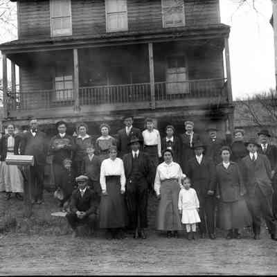 group of 22 people front of house