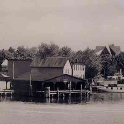 Wharf from the deck of an approaching, unidentified steamboat. Circa 1937