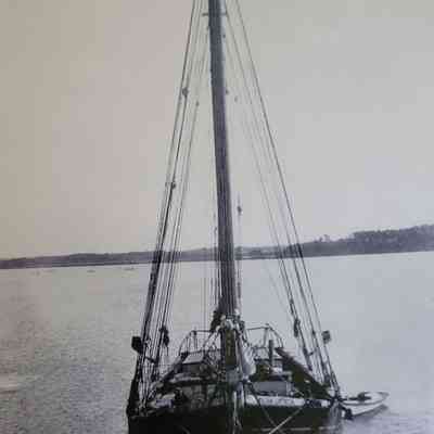 Schooner "William Linthicum" moored near Millenbeck Wharf. Appears to be a buy boat at her bow.