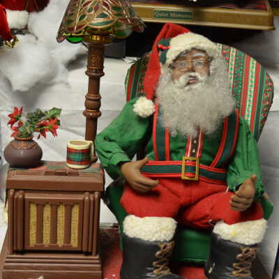 Santa in easy chair with radio and lamp
