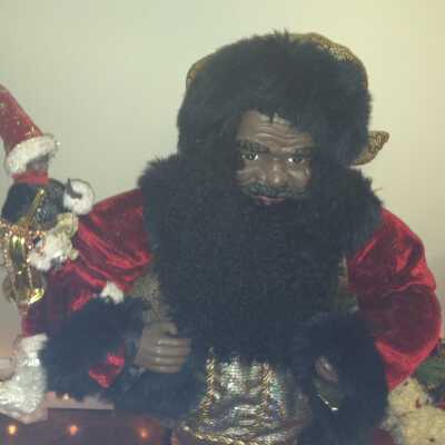 Elf on shoulders of Santa