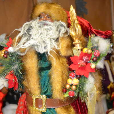 Gold fur Santa with pointsettia